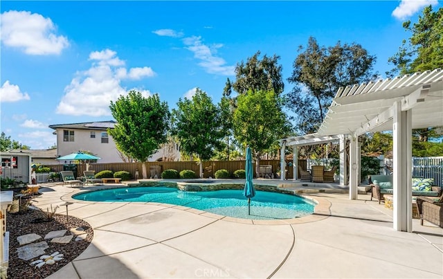 view of swimming pool with a patio, a fenced backyard, a pool with connected hot tub, and a pergola