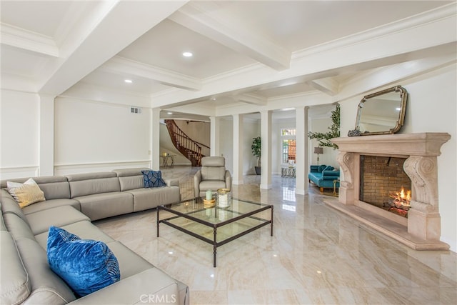 living room featuring beam ceiling, marble finish floor, visible vents, a premium fireplace, and ornamental molding