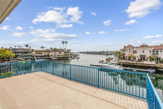 exterior space featuring a water view and a balcony