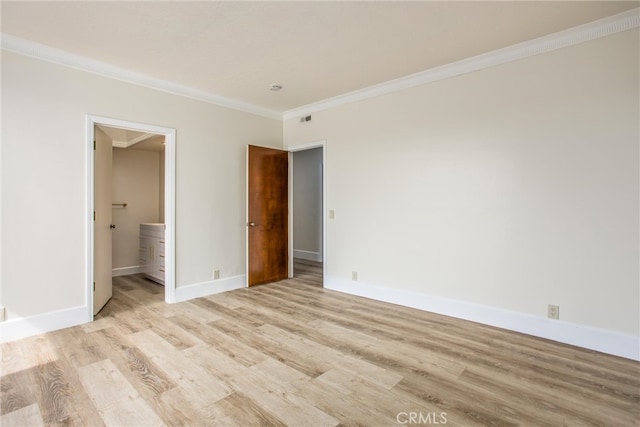 unfurnished bedroom with ornamental molding, visible vents, light wood-style flooring, and baseboards