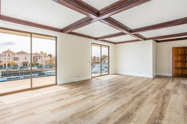 unfurnished room featuring baseboards, coffered ceiling, ornamental molding, beamed ceiling, and light wood-style floors