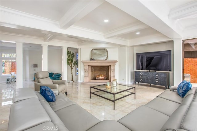 living area with marble finish floor, a fireplace, ornamental molding, beamed ceiling, and ornate columns