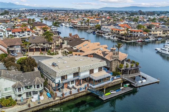 bird's eye view featuring a water and mountain view and a residential view