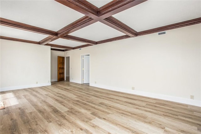 unfurnished room featuring light wood-style floors, baseboards, visible vents, and coffered ceiling