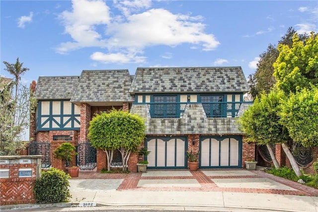 view of front of property with a balcony and brick siding