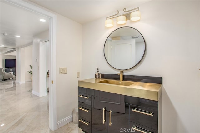 bathroom with recessed lighting, visible vents, vanity, baseboards, and marble finish floor