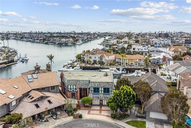 bird's eye view with a residential view and a water view