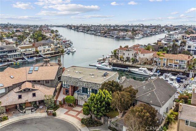 bird's eye view with a water view and a residential view