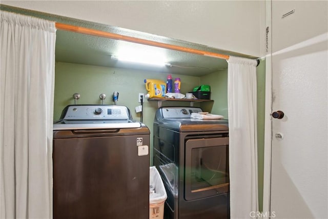 laundry area featuring laundry area and washing machine and clothes dryer