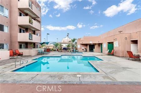 view of pool featuring a patio area