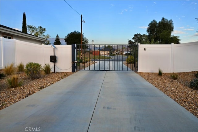 view of gate featuring fence