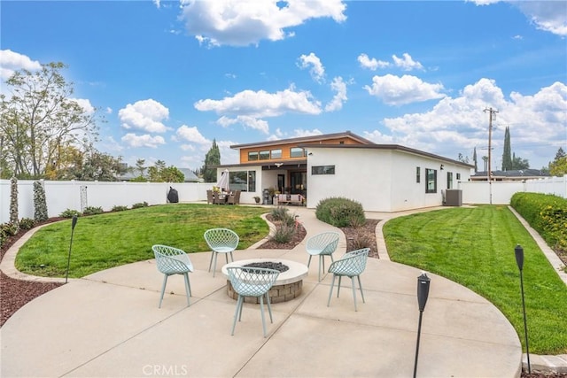 back of house with a lawn, a fenced backyard, a patio area, and cooling unit