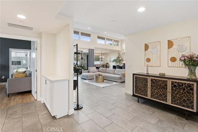 interior space featuring recessed lighting, visible vents, and light tile patterned flooring