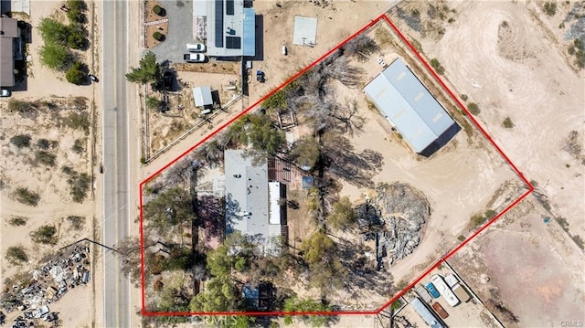 birds eye view of property with a desert view