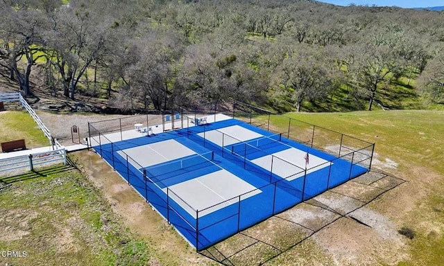2438 Captains Walk, Bradley, CA 93426 - view of sport court featuring a tennis court and a wooded view