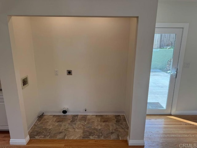 laundry area featuring hookup for a washing machine, wood finished floors, baseboards, hookup for an electric dryer, and laundry area