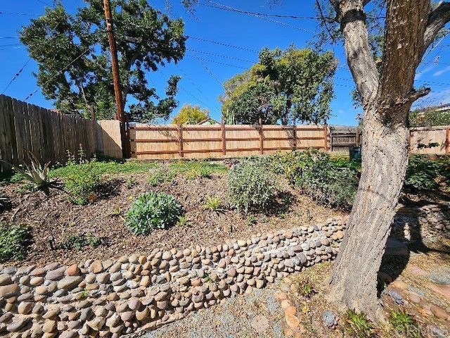 view of yard with a fenced backyard