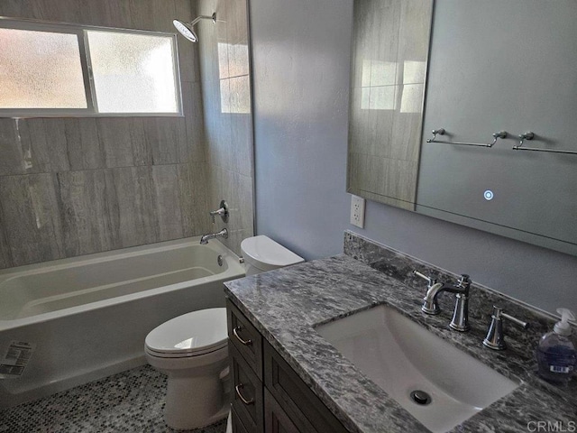 full bathroom featuring vanity, toilet, and  shower combination