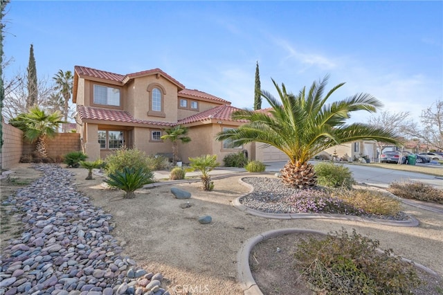 36857 42nd St E, Palmdale, CA 93552 - mediterranean / spanish-style house with driveway, a tiled roof, fence, and stucco siding