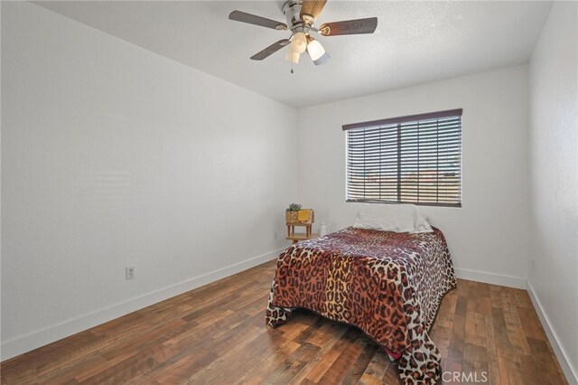 36857 42nd St E, Palmdale, CA 93552 - bedroom with hardwood / wood-style flooring, baseboards, and a ceiling fan