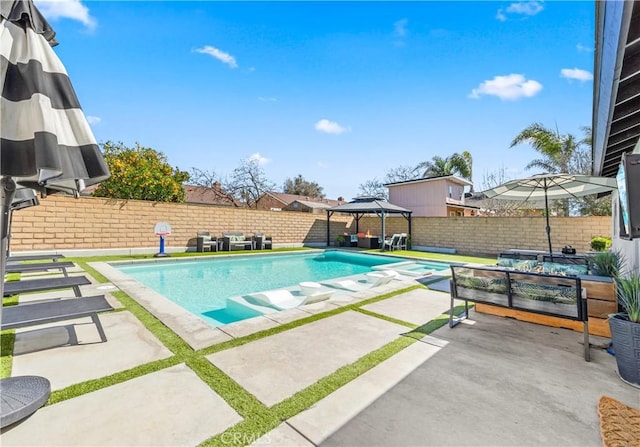 view of swimming pool with a fenced in pool, a fenced backyard, a patio, and a gazebo