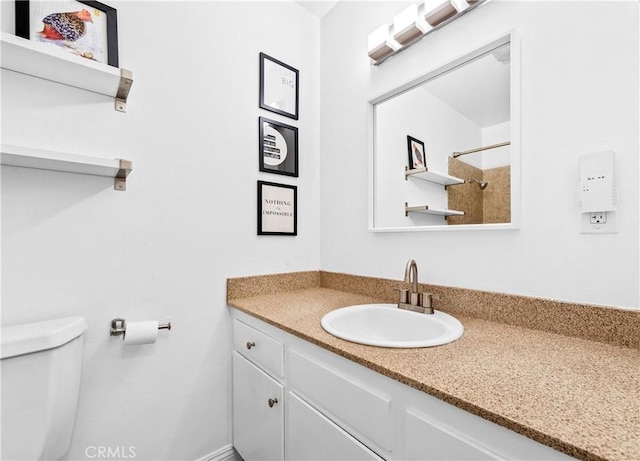 full bath with a shower, vanity, and toilet