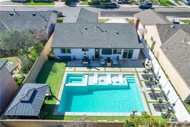 view of swimming pool featuring a fenced backyard and a patio