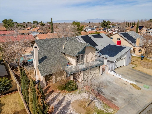 drone / aerial view featuring a mountain view and a residential view