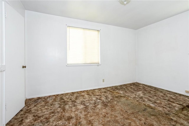 unfurnished room with carpet floors