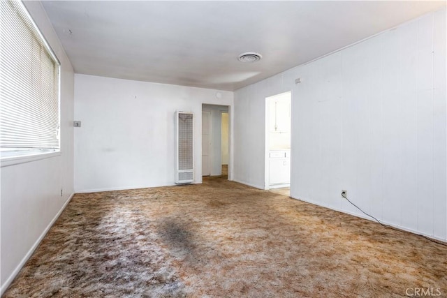 carpeted spare room with visible vents