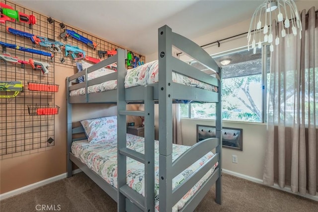 carpeted bedroom featuring baseboards