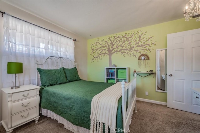 carpeted bedroom with a chandelier and baseboards