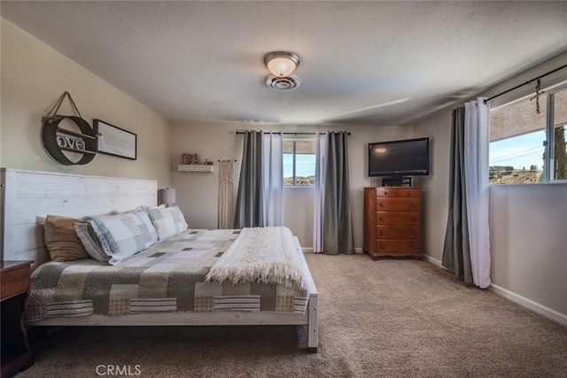 carpeted bedroom with baseboards