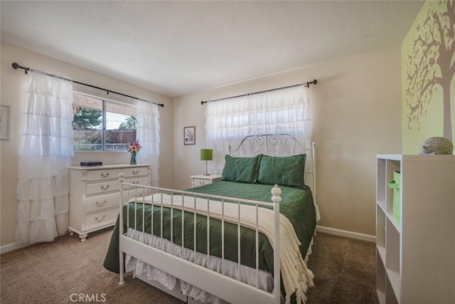 bedroom with carpet floors and baseboards