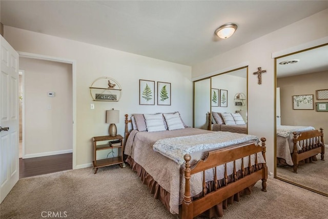 bedroom featuring carpet, a closet, visible vents, and baseboards