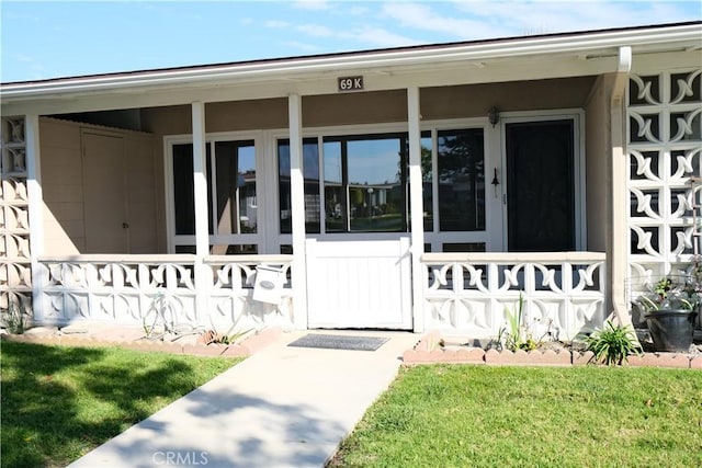 doorway to property with covered porch