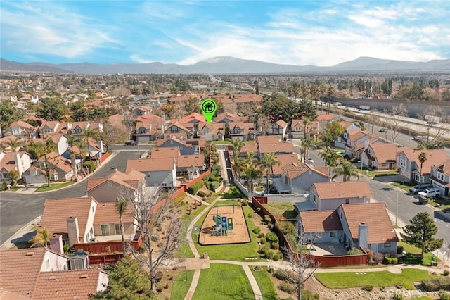 drone / aerial view featuring a residential view and a mountain view