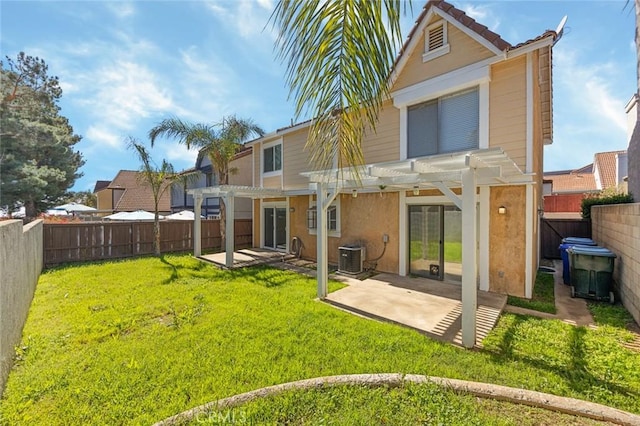 rear view of house featuring a fenced backyard, a yard, a patio area, a pergola, and stucco siding