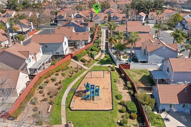 birds eye view of property with a residential view