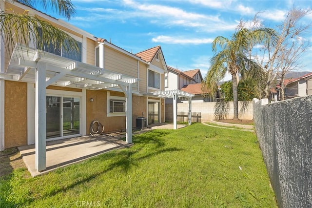 view of yard featuring central air condition unit, a patio area, fence, and a pergola