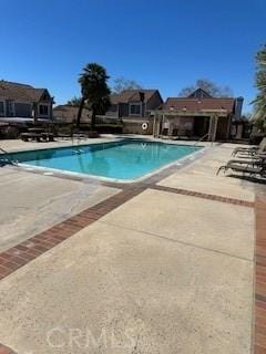 community pool with a patio