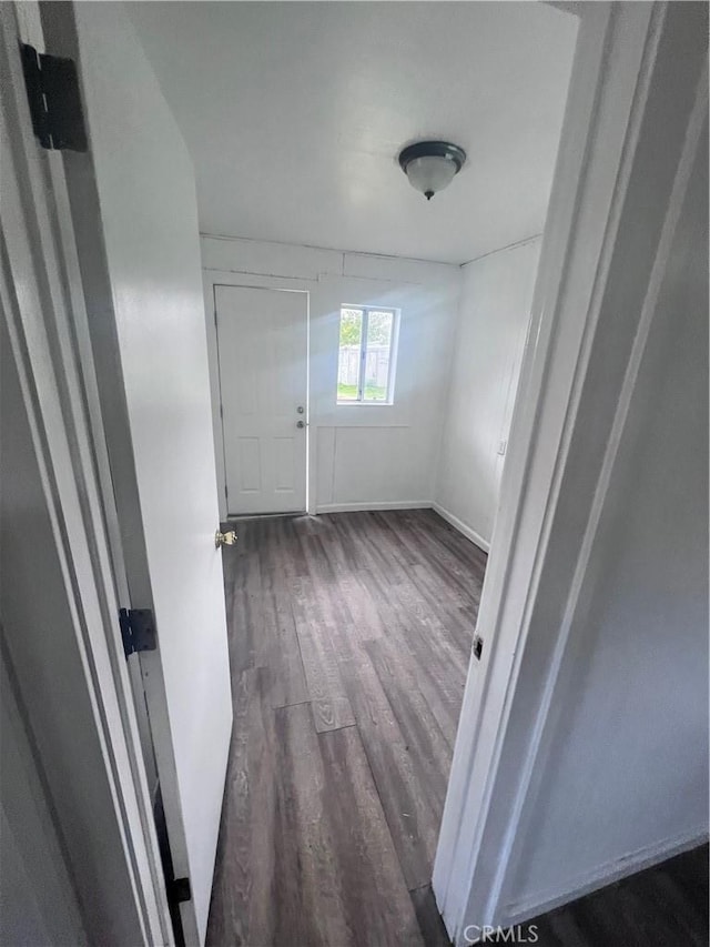 spare room with dark wood-style flooring