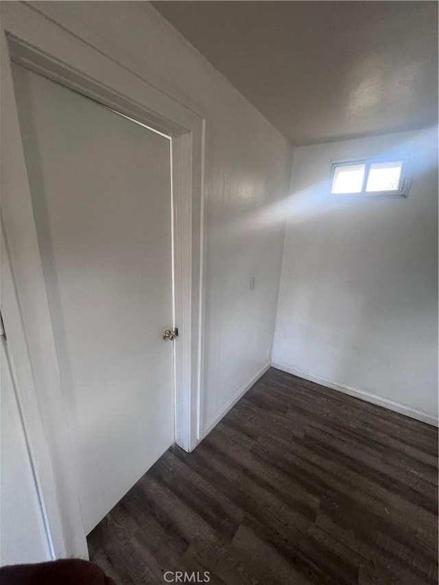 empty room featuring dark wood-style flooring