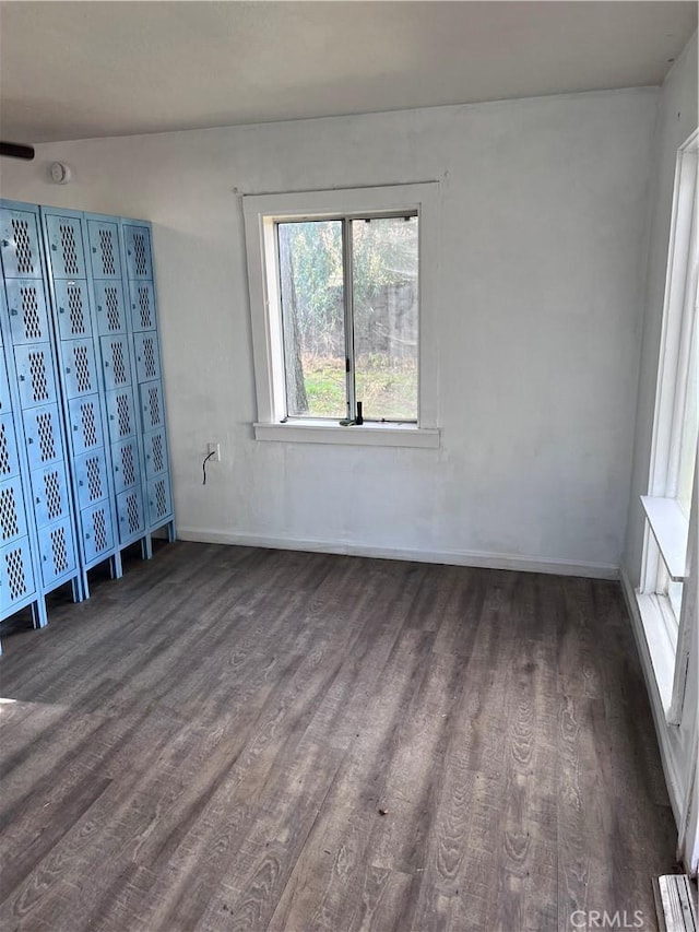 unfurnished bedroom with baseboards and wood finished floors