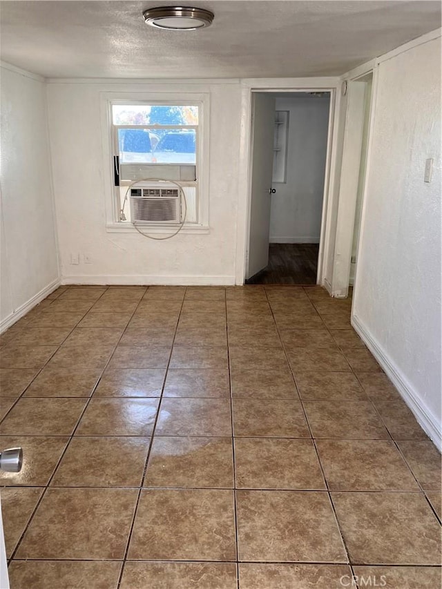 hallway featuring tile patterned flooring, baseboards, and cooling unit