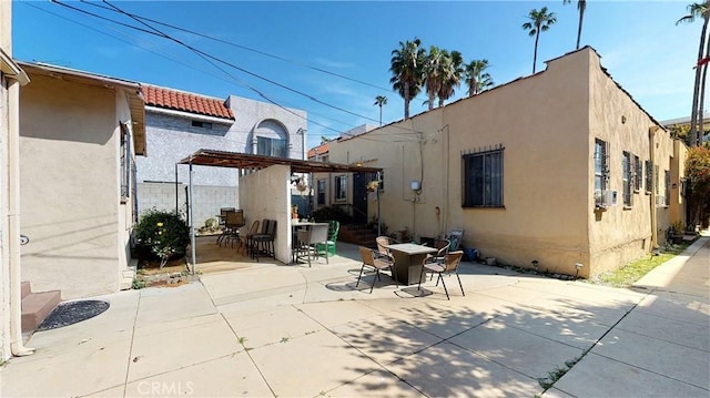 view of patio featuring outdoor dining area