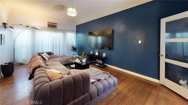 living room with baseboards and wood finished floors