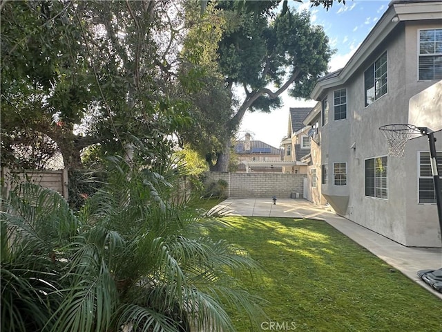 view of yard featuring a fenced backyard and a patio