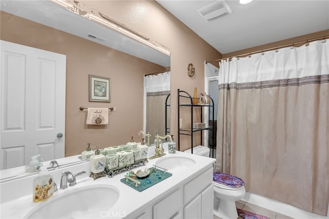 full bath with toilet, a sink, and visible vents