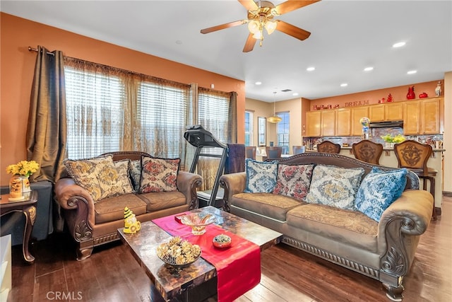 living room with a ceiling fan, wood finished floors, and recessed lighting